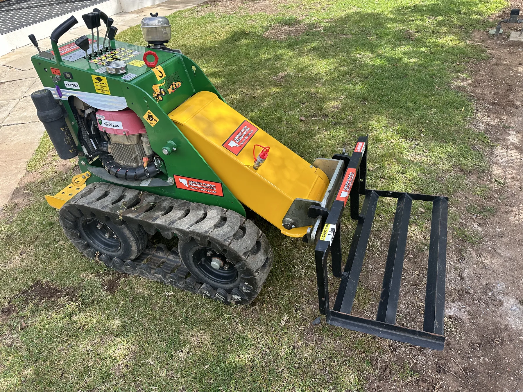 Kanga Kid mini loader with carryall attachment